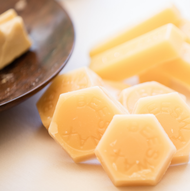 Beeswax pellets sitting on a table