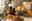 Lavender, cedarwood, citrus peel, eucalyptus and amber oil bottles arranged in warm natural light